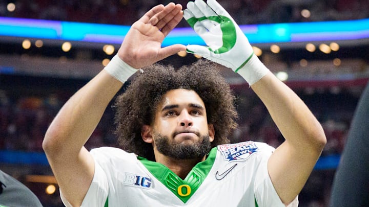 Oregon quarterback Dante Moore walks off the field as the Oregon Ducks face the Indiana Hoosiers in the Peach Bowl on Jan. 9, 2026, at Mercedes-Benz Stadium in Atlanta, Georgia.