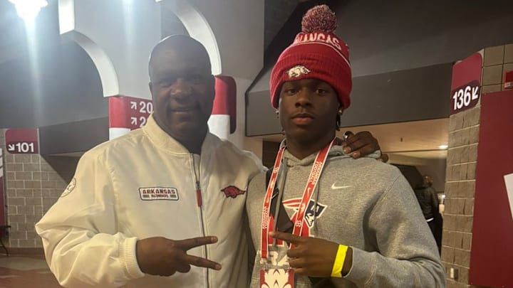 Arkansas running backs coach David Johnson with Marion running back Jeremiah Dent at Razorbacks Junior Day.