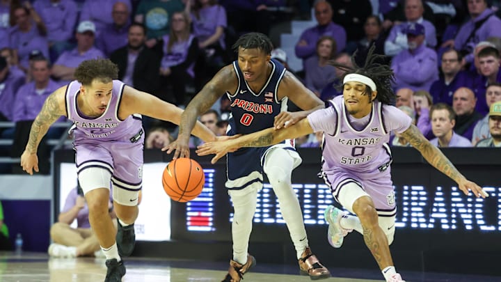 Feb 11, 2025; Manhattan, Kansas, USA; Arizona Wildcats guard Jaden Bradley (0), Kansas State Wildcats guard Dug McDaniel (0) and guard Max Jones (2) go after a loose ball during the second half at Bramlage Coliseum. Mandatory Credit: Scott Sewell-Imagn Images Feb 11, 2025; Manhattan, Kansas, USA; Arizona Wildcats guard Jaden Bradley (0), Kansas State Wildcats guard Dug McDaniel (0) and guard Max Jones (2) go after a loose ball during the second half at Bramlage Coliseum. Mandatory Credit: Scott Sewell-Imagn Images