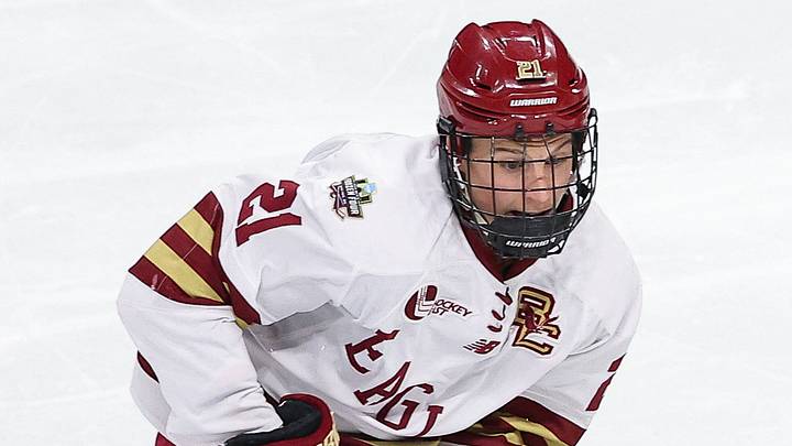 Apr 13, 2024; Saint Paul, Minnesota, USA; Boston College Eagles forward Oskar Jellvik (21) and Denver Pioneers forward Rieger Lorenz (14) compete for the puck during the first period of the championship game of the 2024 Frozen Four college ice hockey tournament at Xcel Energy Center. Mandatory Credit: Matt Krohn-USA TODAY Sports