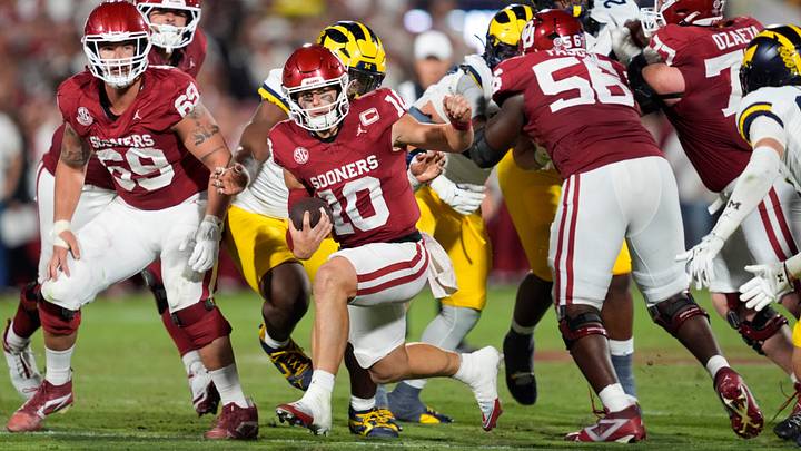 Oklahoma Sooners quarterback John Mateer (10) runs against Michigan. Oklahoma Sooners quarterback John Mateer (10) runs against Michigan.