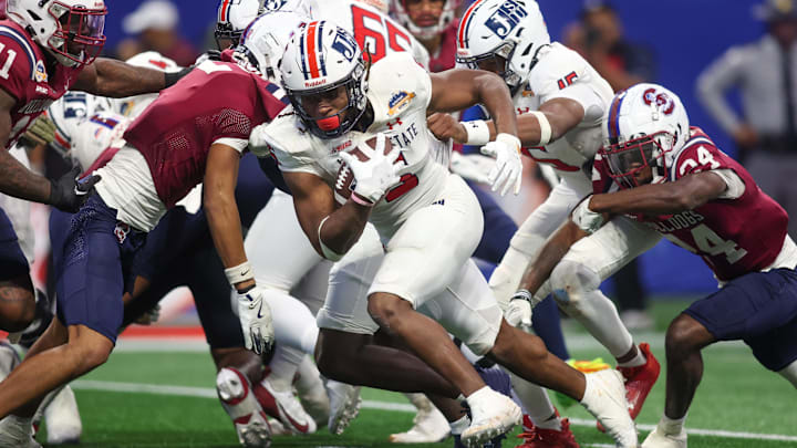 Dec 14, 2024; Atlanta, GA, USA; Jackson State Tigers running back Irv Mulligan (5) runs for a touchdown against the South Carolina State Bulldogs in the fourth quarter at Mercedes-Benz Stadium. Mandatory Credit: Brett Davis-Imagn Images
Dec 14, 2024; Atlanta, GA, USA; Jackson State Tigers running back Irv Mulligan (5) runs for a touchdown against the South Carolina State Bulldogs in the fourth quarter at Mercedes-Benz Stadium. Mandatory Credit: Brett Davis-Imagn Images