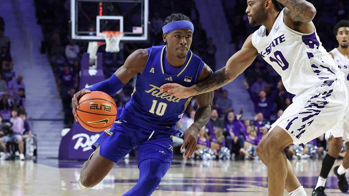 Nov 17, 2025; Manhattan, Kansas, USA; Tulsa Golden Hurricane guard Tylen Riley (10) is guarded by Kansas State Wildcats guard David Castillo (10) during the second half at Bramlage Coliseum. Mandatory Credit: Scott Sewell-Imagn Images