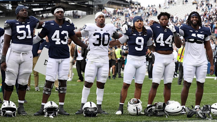 Penn State football players sing their alma mater following the Blue-White Spring Game at Beaver Stadium