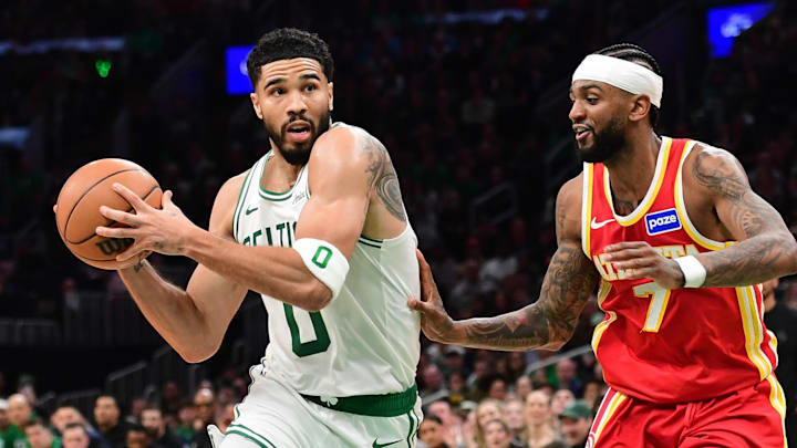 Mar 27, 2026; Boston, Massachusetts, USA; Boston Celtics forward Jayson Tatum (0) drives against Atlanta Hawks guard Nickeil Alexander-Walker (7) during the second half at TD Garden. Mandatory Credit: Bob DeChiara-Imagn Images