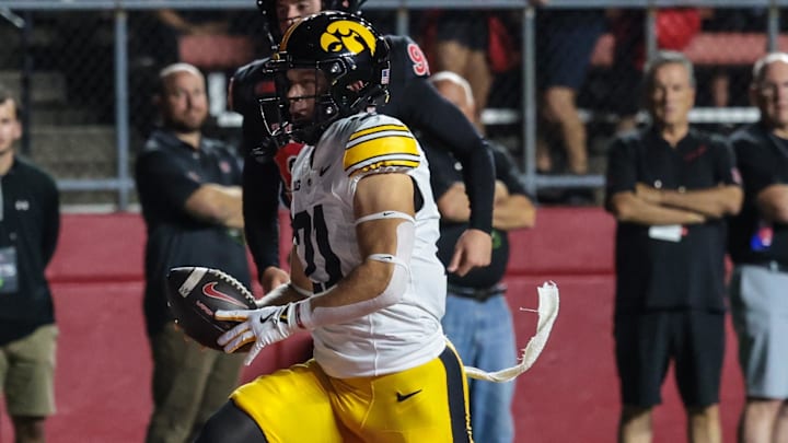 Sep 19, 2025; Piscataway, New Jersey, USA; Iowa Hawkeyes wide receiver Kaden Wetjen (21) returns the opening kick off for a touchdown during the first quarter against the Rutgers Scarlet Knights at SHI Stadium. Mandatory Credit: Vincent Carchietta-Imagn Images