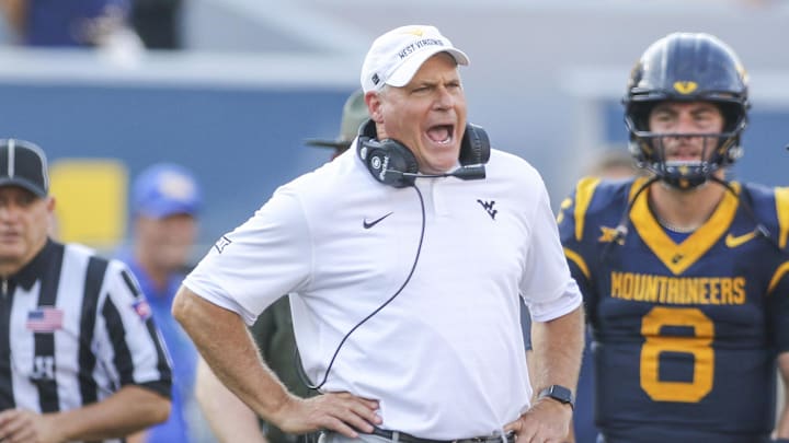 Sep 13, 2025; Morgantown, West Virginia, USA; West Virginia Mountaineers head coach Rich Rodriguez yells at the referee during the second quarter against the Pittsburgh Panthers at Milan Puskar Stadium. Mandatory Credit: Ben Queen-Imagn Images