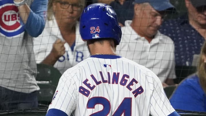 Sep 16, 2024; Chicago, Illinois, USA; Chicago Cubs outfielder Cody Bellinger (24) is greeted after scoring against the Oakland Athletics during the fourth inning at Wrigley Field