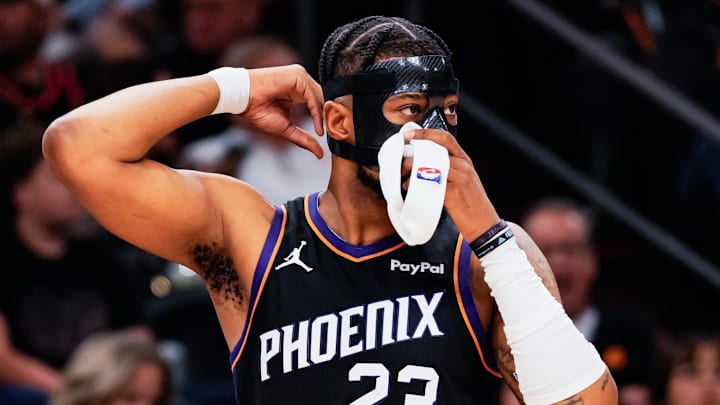 Feb 10, 2026; Phoenix, Arizona, USA; Phoenix Suns guard Jordan Goodwin (23) puts on a face shield in the first half of the game at Mortgage Matchup Center. Mandatory Credit: Arianna Grainey-Imagn Images