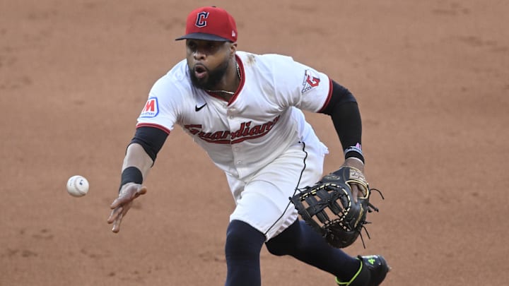 Jul 23, 2025; Cleveland, Ohio, USA; Cleveland Guardians first baseman Carlos Santana (41) tosses the ball to first base in the sixth inning against the Baltimore Orioles at Progressive Field. Mandatory Credit: David Richard-Imagn Images