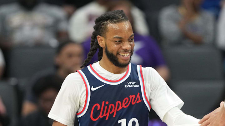 Apr 5, 2026; Sacramento, California, USA; LA Clippers guard Darius Garland (10) is congratulated by center Brook Lopez (11) during the second quarter against the Sacramento Kings at Golden 1 Center. Mandatory Credit: Darren Yamashita-Imagn Images