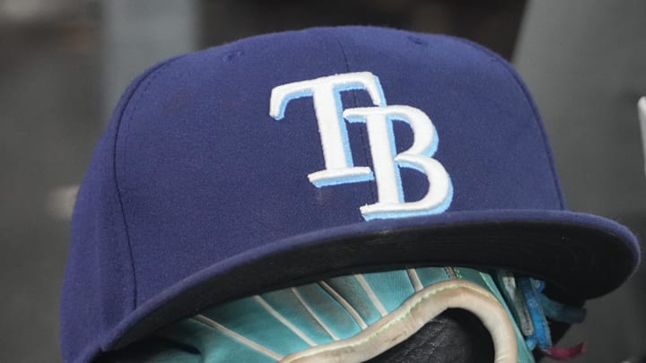 Sep 26, 2025; Toronto, Ontario, CAN; The hat and glove of Tampa Bay Rays third baseman Junior Caminero (13) in the dugout during the game against the Toronto Blue Jays at Rogers Centre. 