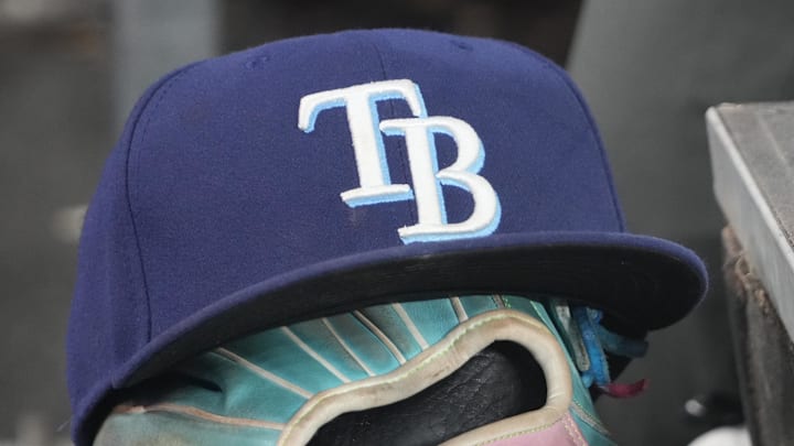 Sep 26, 2025; Toronto, Ontario, CAN; The hat and glove of Tampa Bay Rays third baseman Junior Caminero (13) in the dugout during the game against the Toronto Blue Jays at Rogers Centre. 