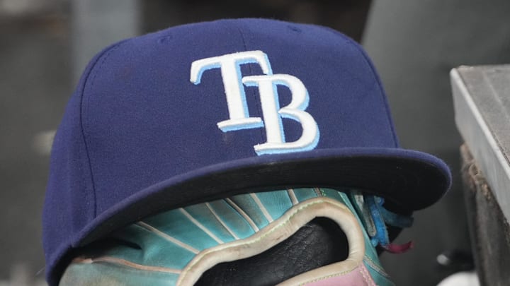 Sep 26, 2025; Toronto, Ontario, CAN; The hat and glove of Tampa Bay Rays third baseman Junior Caminero (13) in the dugout during the game against the Toronto Blue Jays at Rogers Centre. 