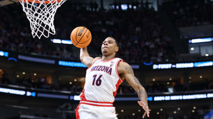 Mar 23, 2024; Salt Lake City, UT, USA; Arizona Wildcats forward Keshad Johnson (16) dunks against Dayton Flyers guard Enoch Cheeks (6) during the first half in the second round of the 2024 NCAA Tournament at Vivint Smart Home Arena-Delta Center. Mandatory Credit: Rob Gray-USA TODAY Sports Mar 23, 2024; Salt Lake City, UT, USA; Arizona Wildcats forward Keshad Johnson (16) dunks against Dayton Flyers guard Enoch Cheeks (6) during the first half in the second round of the 2024 NCAA Tournament at Vivint Smart Home Arena-Delta Center. Mandatory Credit: Rob Gray-USA TODAY Sports