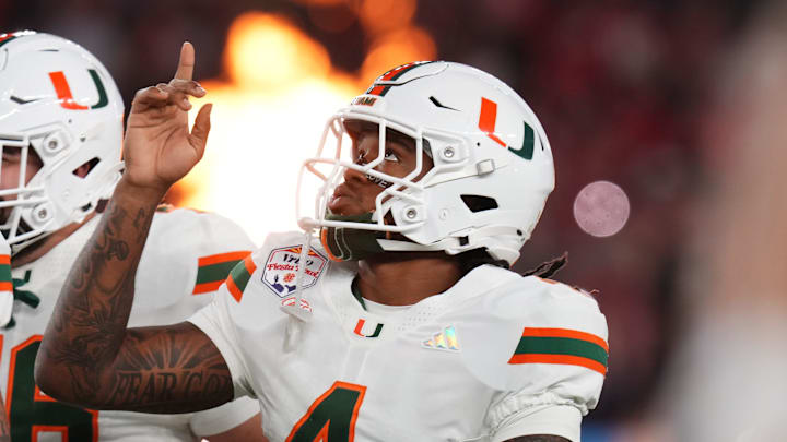 Miami Hurricanes running back Mark Fletcher Jr. (4) takes the field before they play the Ole Miss Rebels during their Vrbo Fiesta Bowl matchup at State Farm Stadium in Glendale, on Jan. 8, 2026.