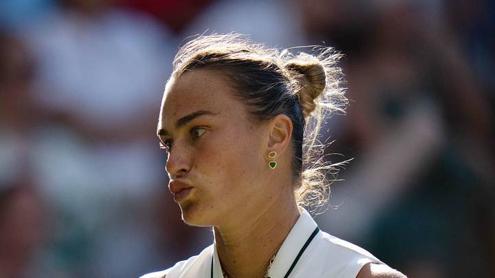 Aryna Sabalenka reacts during her match at Wimbledon Aryna Sabalenka reacts during her match at Wimbledon