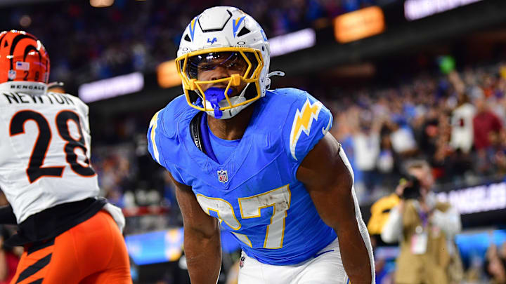 Nov 17, 2024; Inglewood, California, USA; Los Angeles Chargers running back J.K. Dobbins (27) celebrates his touchdown scored against the Cincinnati Bengals during the second half at SoFi Stadium. Mandatory Credit: Gary A. Vasquez-Imagn Images