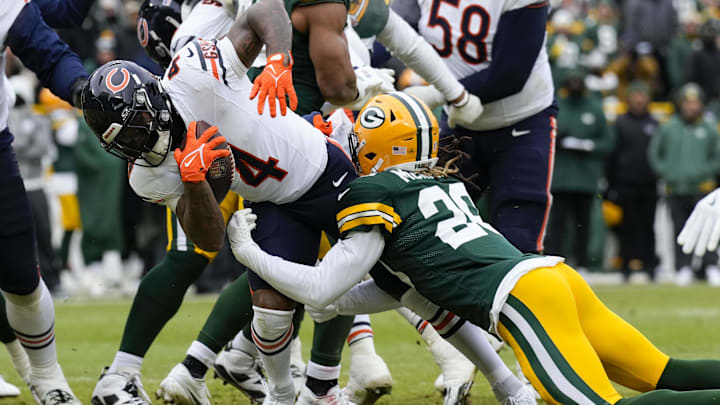 D'Andre Swift is dragged down behind at line against Green Bay. The Bears' running game is critical this year yet unproven. D'Andre Swift is dragged down behind at line against Green Bay. The Bears' running game is critical this year yet unproven.