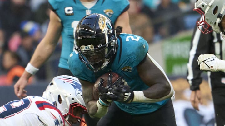 Oct 20, 2024; London, United Kingdom; Jacksonville Jaguars running back D'Ernest Johnson (2) carries the ball in the game against the New England Patriots  during an NFL International Series game at Wembley Stadium. Mandatory Credit: Peter van den Berg-Imagn Images