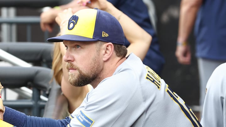 Jul 2, 2025; New York City, New York, USA;  Milwaukee Brewers first baseman Rhys Hoskins (12) watches from the dugout prior to game against the New York Mets at Citi Field. Mandatory Credit: Wendell Cruz-Imagn Images