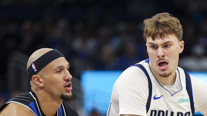 Dallas Mavericks forward Cooper Flagg is guarded by Orlando Magic guard Jalen Suggs.