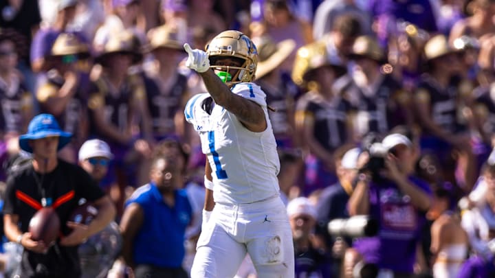 Sep 21, 2024; Baton Rouge, Louisiana, USA;  UCLA Bruins wide receiver Rico Flores Jr. (1) reacts after making a first down against LSU Tigers cornerback Ashton Stamps (1) during the first half at Tiger Stadium. Mandatory Credit: Stephen Lew-Imagn Images