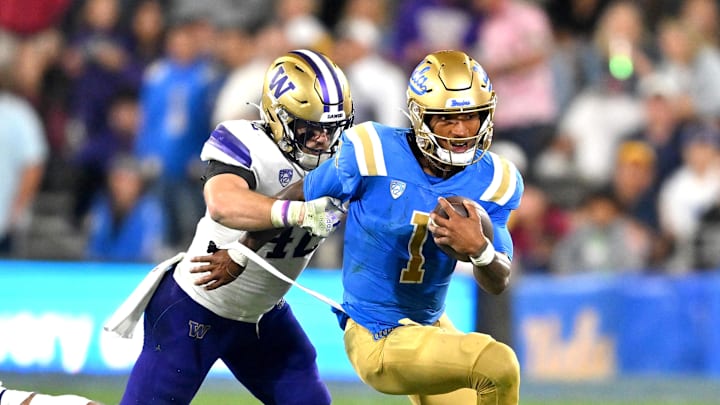 Sep 30, 2022; Pasadena, California, USA; UCLA Bruins quarterback Dorian Thompson-Robinson (1) runs for a 4 yard gain in the second half against the Washington Huskies at the Rose Bowl. Mandatory Credit: Jayne Kamin-Oncea-Imagn Images