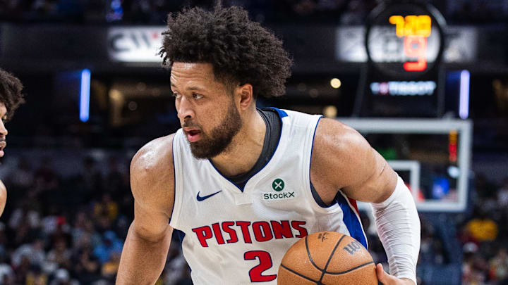 Apr 12, 2026; Indianapolis, Indiana, USA;  Detroit Pistons guard Cade Cunningham (2) dribbles the ball while Indiana Pacers guard Ethan Thompson (55) defends in the second half at Gainbridge Fieldhouse. Mandatory Credit: Trevor Ruszkowski-Imagn Images