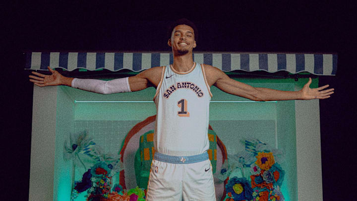 Victor Wembanyama poses in the San Antonio Spurs' new City Edition Uniforms. Victor Wembanyama poses in the San Antonio Spurs' new City Edition Uniforms.