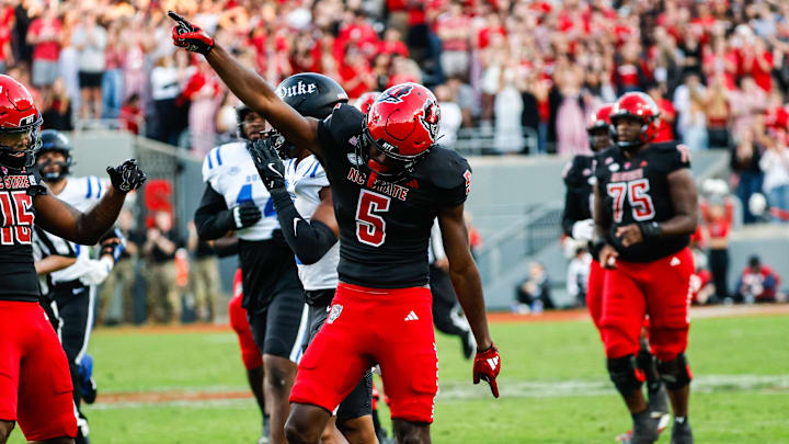 Nov 9, 2024; Raleigh, North Carolina, USA; North Carolina State Wolfpack wide receiver Noah Rogers (5) celebrates during the first half of the game against Duke Blue Devils at Carter-Finley Stadium. Mandatory Credit: Jaylynn Nash-Imagn Images