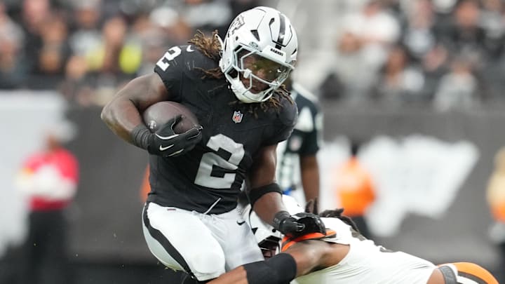 Nov 23, 2025; Paradise, Nevada, USA; Las Vegas Raiders running back Ashton Jeanty (2) runs against Cleveland Browns linebacker Devin Bush (30) in the first half at Allegiant Stadium. Mandatory Credit: Stephen R. Sylvanie-Imagn Images
