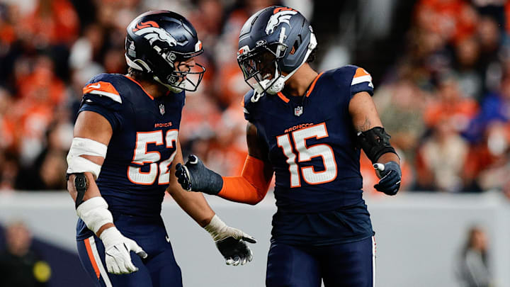 Sep 29, 2025; Denver, Colorado, USA; Denver Broncos linebacker Nik Bonitto (15) celebrates with Denver Broncos linebacker Jonah Elliss (52) after sacking Cincinnati Bengals quarterback Jake Browning (6) (not pictured) during the third quarter at Empower Field at Mile High. 