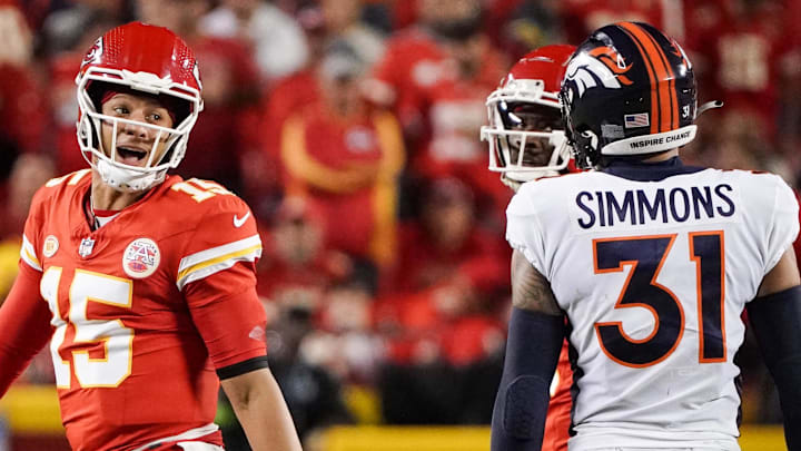 Oct 12, 2023; Kansas City, Missouri, USA; Kansas City Chiefs quarterback Patrick Mahomes (15) speaks to Denver Broncos safety Justin Simmons (31) after a play during the first half at GEHA Field at Arrowhead Stadium. Mandatory Credit: Denny Medley-Imagn Images