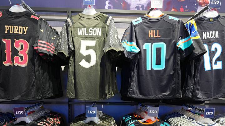 Oct 4, 2025; London, United Kingdom; The Nike rivalry jerseys of San Francisco 49ers quarterback Brock Purdy (13), New York Jets receiver Garrett Wilson (5), Miami Dolphins receiver TYreek Hill (10) and Los Angeles Rams receiver Puka Nacua (12) at the NFL Shop at Tottenham Hotspur Stadium.  Mandatory Credit: Kirby Lee-Imagn Images