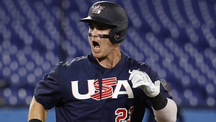 Aug 7, 2021; Yokohama, Japan; Team United States outfielder Christopher Austin (23) reacts as he hits a single against Japan in the baseball gold medal match during the Tokyo 2020 Olympic Summer Games at Yokohama Baseball Stadium. Mandatory Credit: Yukihito Taguchi-Imagn Images