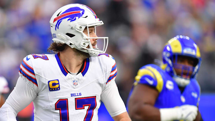 Dec 8, 2024; Inglewood, California, USA;  Buffalo Bills quarterback Josh Allen (17) runs the ball against the against the Los Angeles Rams during the first half at SoFi Stadium. Mandatory Credit: Gary A. Vasquez-Imagn Images