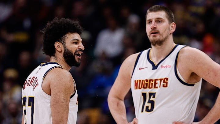 Feb 10, 2025; Denver, Colorado, USA; Denver Nuggets guard Jamal Murray (27) reacts after a call as center Nikola Jokic (15) looks on in the third quarter against the Portland Trail Blazers at Ball Arena.