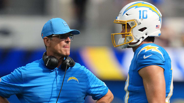 Aug 16, 2025; Inglewood, California, USA; Los Angeles Chargers coach Jim Harbaugh (left) talks with quarterback Justin Herbert (10) against the Los Angeles Rams in the first half at SoFi Stadium. Mandatory Credit: Kirby Lee-Imagn Images Aug 16, 2025; Inglewood, California, USA; Los Angeles Chargers coach Jim Harbaugh (left) talks with quarterback Justin Herbert (10) against the Los Angeles Rams in the first half at SoFi Stadium. Mandatory Credit: Kirby Lee-Imagn Images