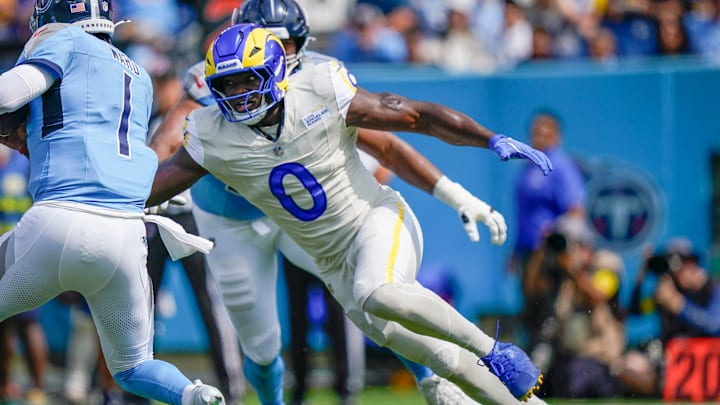 Tennessee Titans quarterback Cam Ward (1) is sacked by Los Angeles Rams linebacker Byron Young (0) during the first quarter at Niss