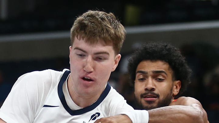 Memphis Grizzlies center Lawson Lovering and Atlanta Hawks forward Jacob Toppin.