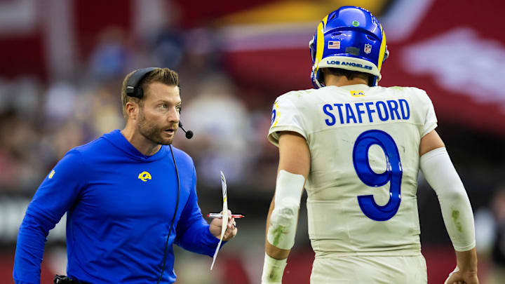 Nov 26, 2023; Glendale, Arizona, USA; Los Angeles Rams head coach Sean McVay talks with quarterback Matthew Stafford (9) against the Arizona Cardinals at State Farm Stadium. Mandatory Credit: Mark J. Rebilas-Imagn Images