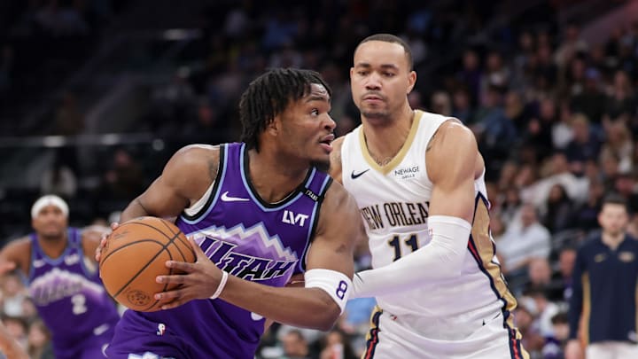 Feb 28, 2026; Salt Lake City, Utah, USA;  Utah Jazz guard Isaiah Collier (8) tries to get past New Orleans Pelicans guard Bryce McGowens (11) and to the basket during the second half at Delta Center. Mandatory Credit: Chris Nicoll-Imagn Images