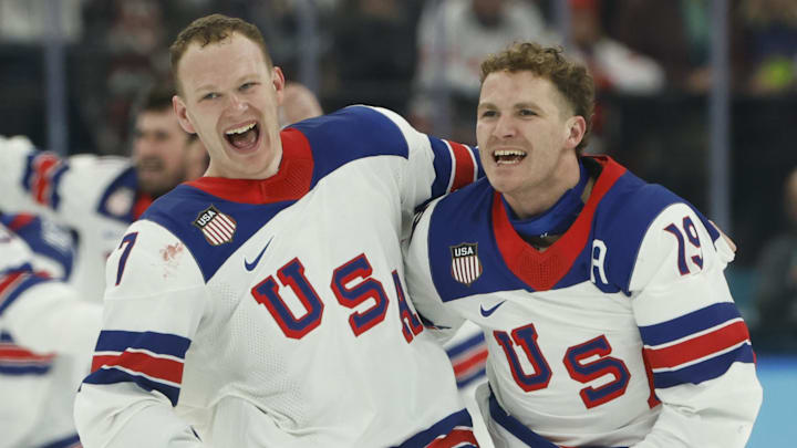 Feb 22, 2026; Milan, Italy; Brady Tkachuk #7 of Team United States and Matthew Tkachuk #19 of Team United States celebrate after their game against Team Canada during the Milano Cortina 2026 Olympic Winter Games at Milano Santagiulia Ice Hockey Arena. Mandatory Credit: Geoff Burke-Imagn Images