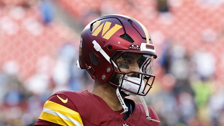 Washington Commanders quarterback Marcus Mariota warms up before a game against the Detroit Lions.