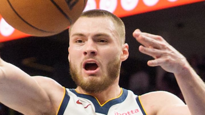 Apr 25, 2026; Minneapolis, Minnesota, USA; Denver Nuggets guard Christian Braun (0) passes the ball against the Minnesota Timberwolves in the fourth quarter at Target Center. Mandatory Credit: Matt Blewett-Imagn Images