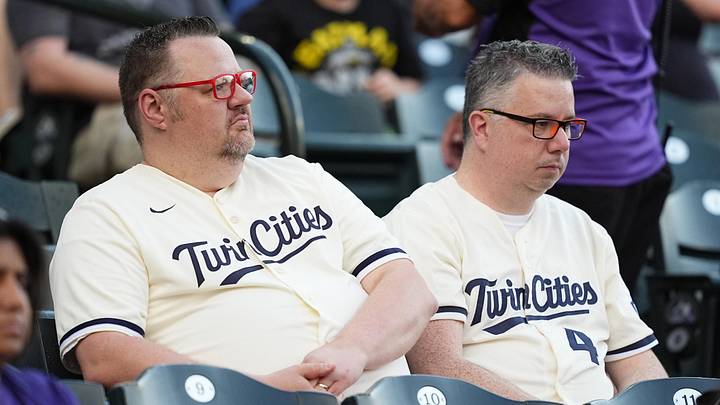 Jul 19, 2025; Denver, Colorado, USA; Minnesota Twins fans following a rain delay against the Colorado Rockies at Coors Field. Mandatory Credit: Ron Chenoy-Imagn Images