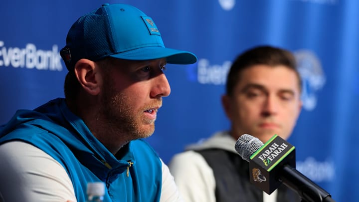 Jacksonville Jaguars head coach Liam Coen speaks during a press conference as general manager James Gladstone looks on at the Miller Electric Center, Wednesday, Jan. 14, 2026, in Jacksonville, Fla.