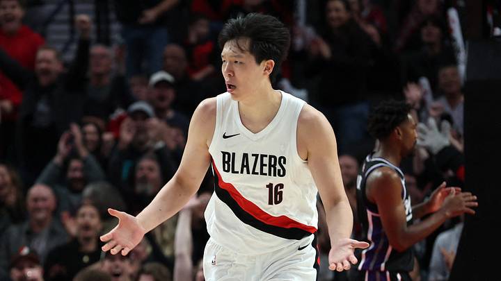 Oct 10, 2025; Portland, Oregon, USA;  Oct 10, 2025; Portland, Oregon, USA;  Portland Trail Blazers center Yang Hansen  (16) reacts after not getting a foul against Sacramento Kings in the second half at Moda Center. Mandatory Credit: Jaime Valdez-Imagn Images