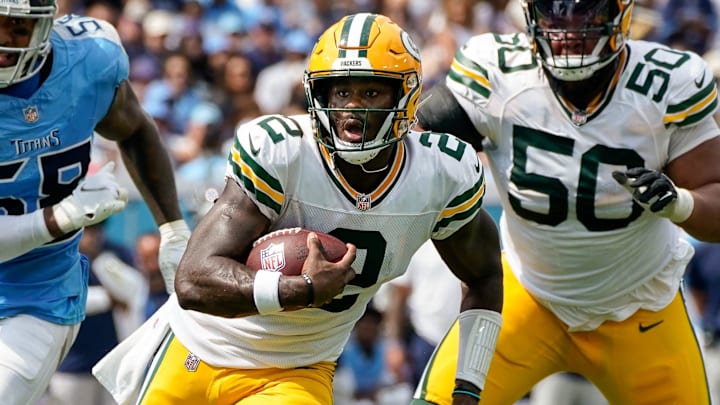 Green Bay Packers quarterback Malik Willis (2) runs the ball past Tennessee Titans linebacker Harold Landry III (58) during the second quarter at Nissan Stadium in Nashville, Tenn., Sunday, Sept. 22, 2024. Green Bay Packers quarterback Malik Willis (2) runs the ball past Tennessee Titans linebacker Harold Landry III (58) during the second quarter at Nissan Stadium in Nashville, Tenn., Sunday, Sept. 22, 2024.